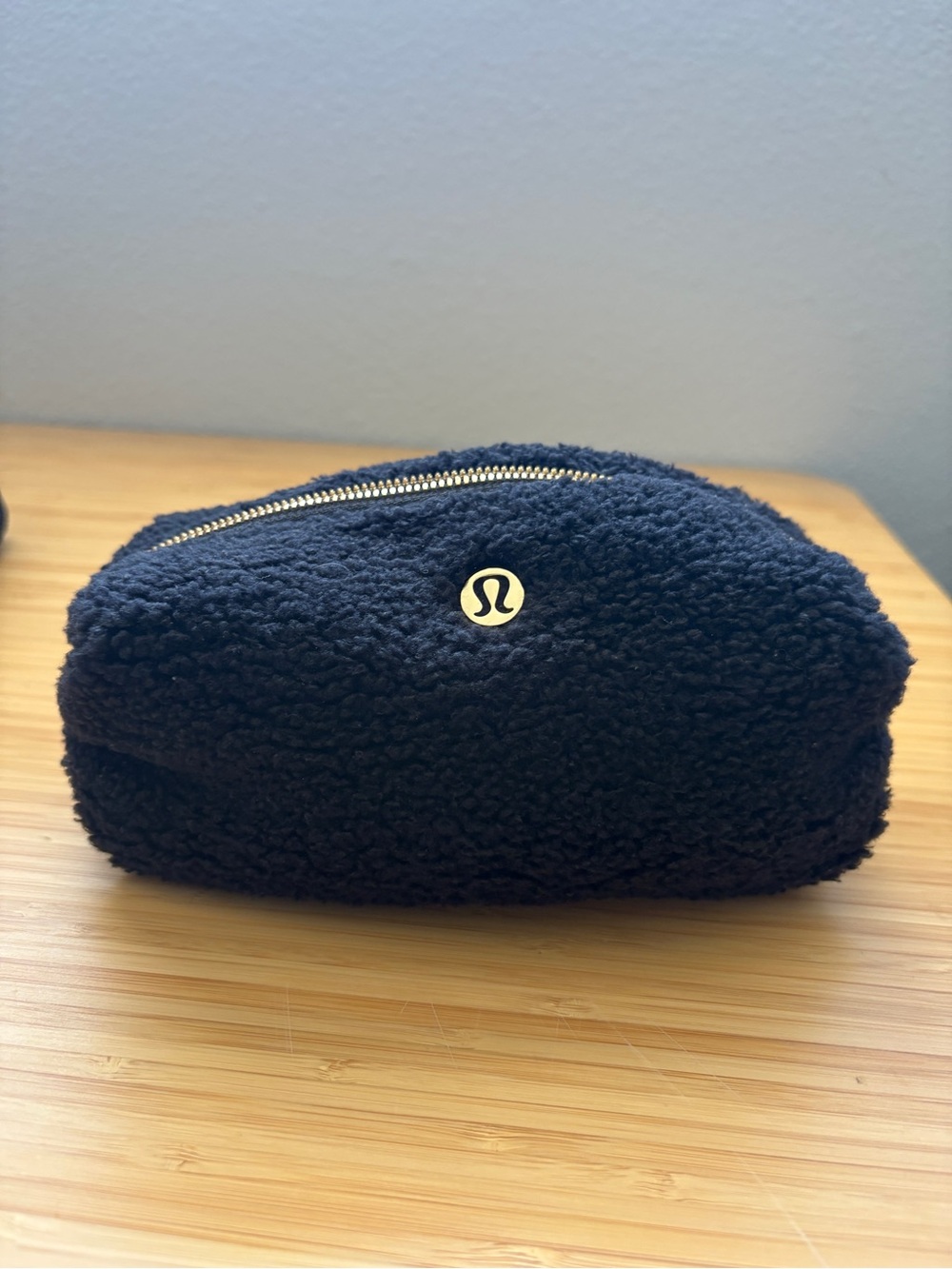 lululemon black sherpa zip pouch with gold zipper